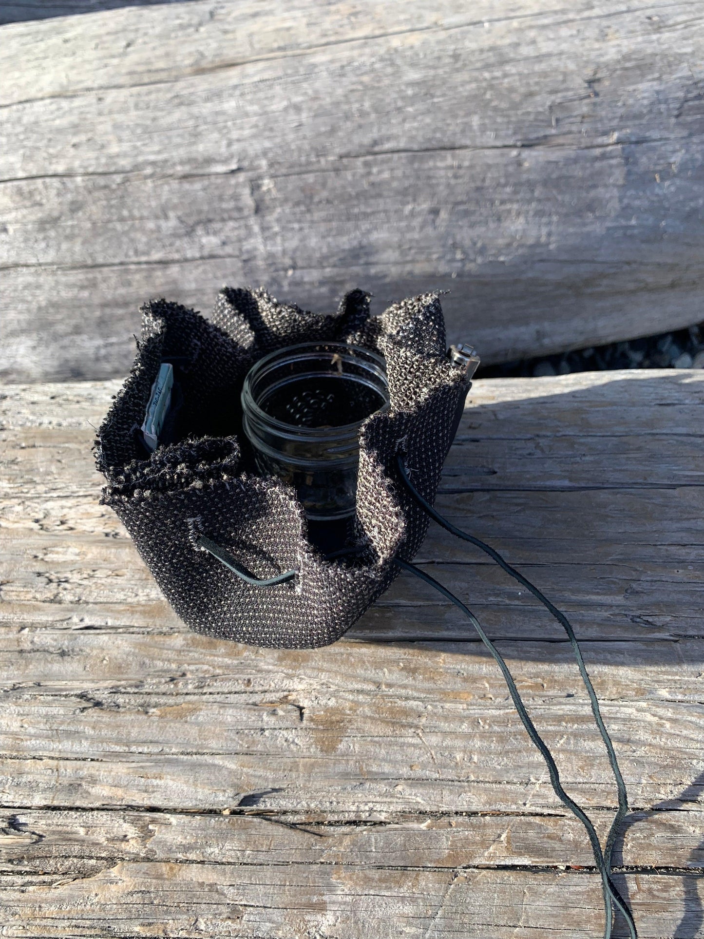 This herbal pouch is designed to discreetly store all of your herb tools for a sleek and organized solution that is perfect for discerning clients. Made with high-quality designer fabrics and premium leathers, this portable and stylish nest features a circular shape and a leather landing pad for convenience. It also includes pockets for storage.