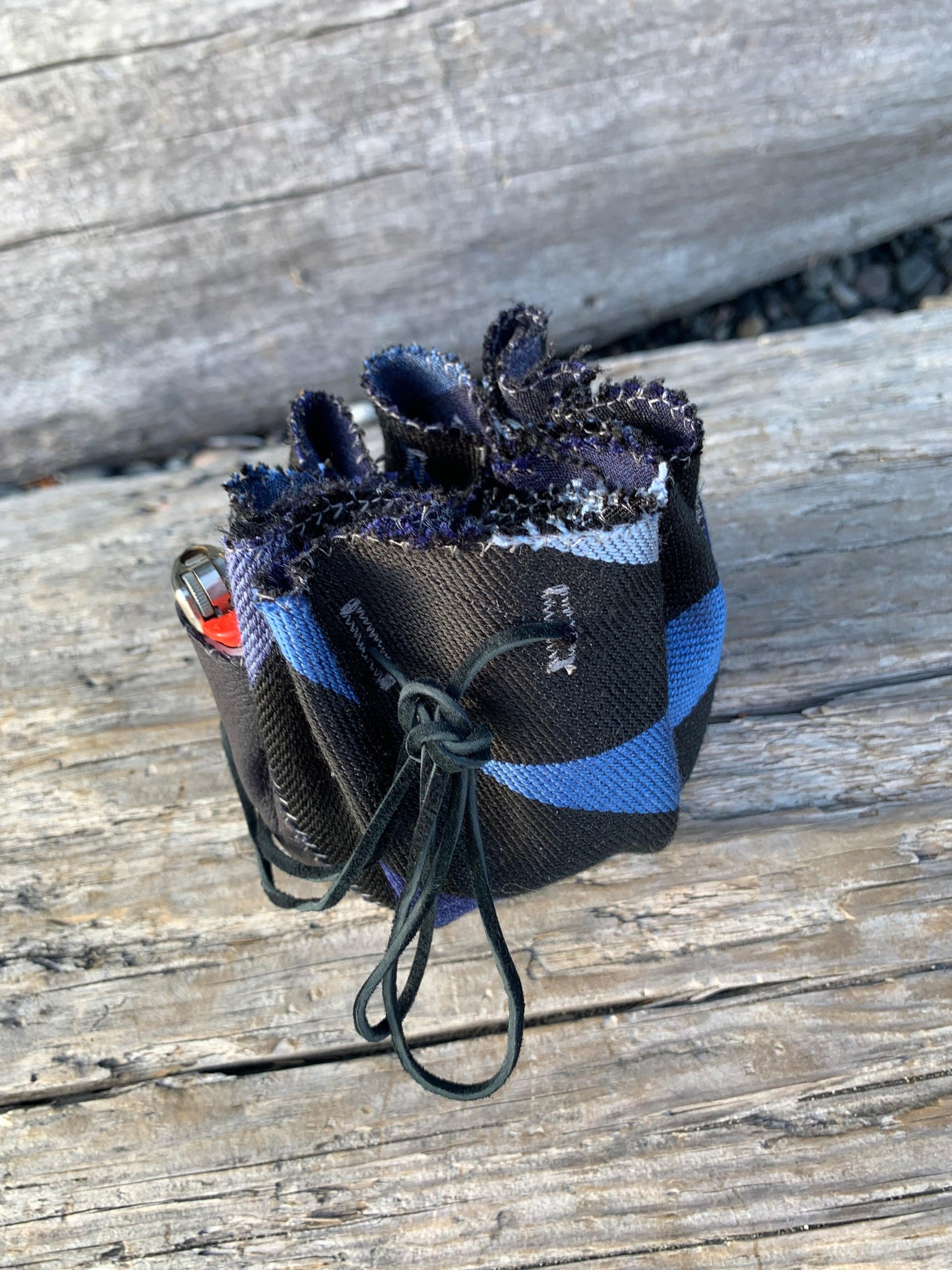 This herbal pouch is designed to discreetly store all of your herb tools for a sleek and organized solution that is perfect for discerning clients. Made with high-quality designer fabrics and premium leathers, this portable and stylish nest features a circular shape and a leather landing pad for convenience.  It also includes convenient pockets for storage.