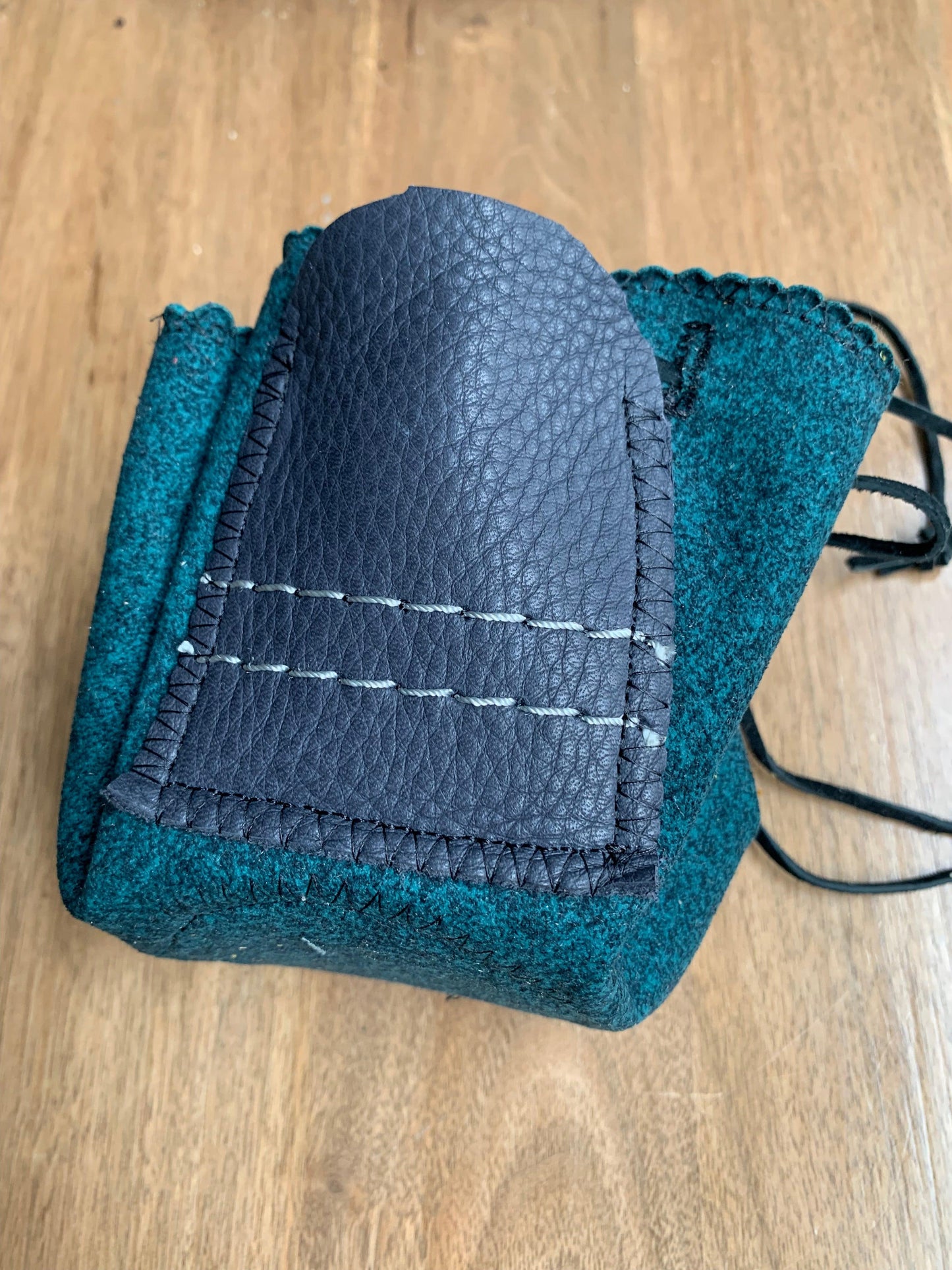 This Herbal pouch is designed to discreetly store all of your herb tools for a sleek and organized solution that is perfect for discerning clients. Made with high-quality designer fabrics and premium leathers, this portable and stylish nest features a circular shape and a leather landing pad for convenience. It also includes convenient pockets for storage.