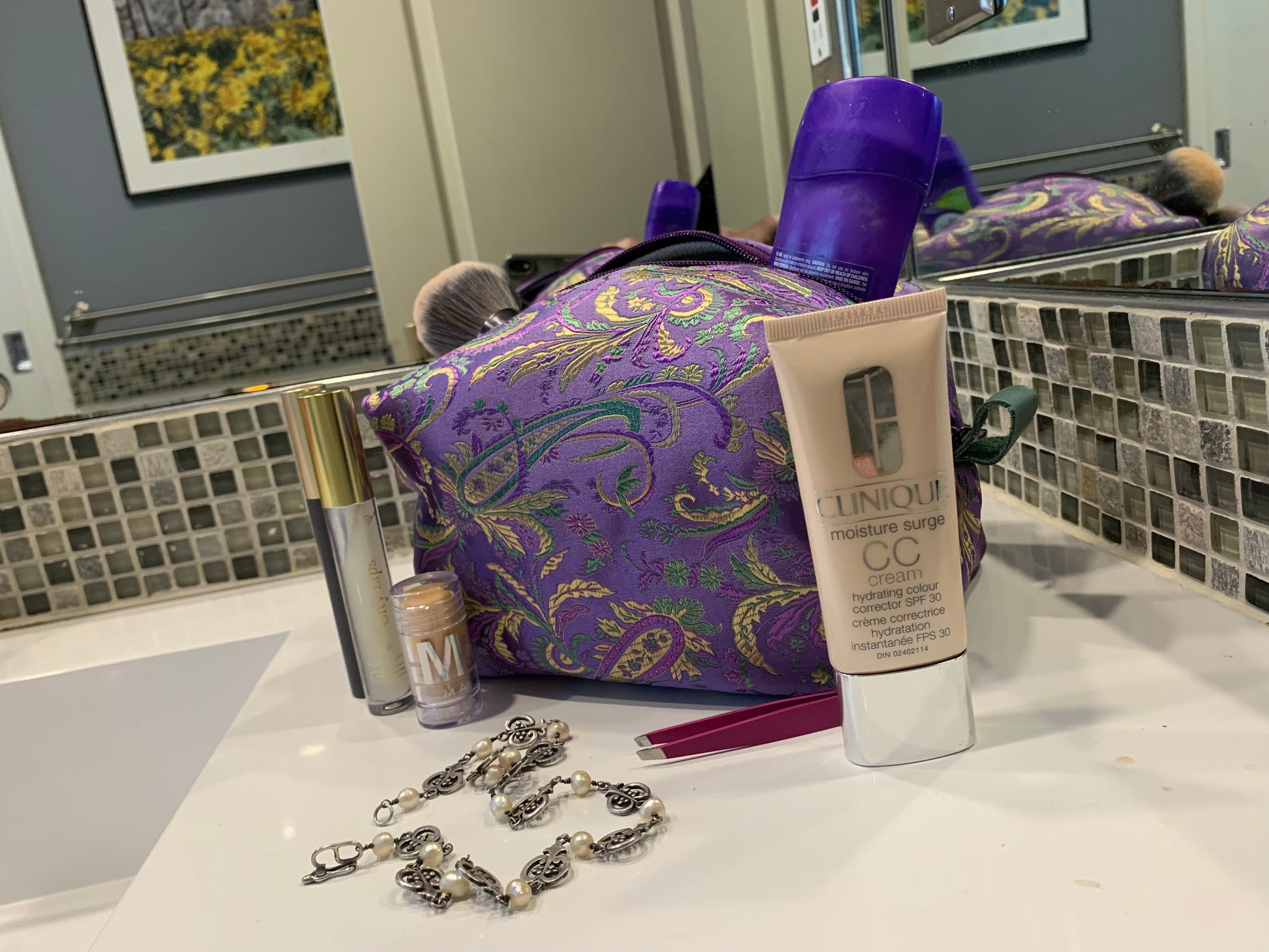 Paisley silk with purple zipper and soft green thumb handles. Strike up the fun. 