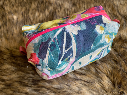 This fabric is a show stopper! Just like an oil painting. The floral is bright and cheery to greet the day, plus a fun pink zipper and leather thumb handles Nest all of your precious essentials together with elegance. The fabrics are natural fibres, and as unique as each day. Includes an extra cosmetic/brush bag, Each Nesting Essentials is fully lined and padded with unbleached 100% cotton. Hand wash as needed. Make caring for your personal self a glamorous affair.