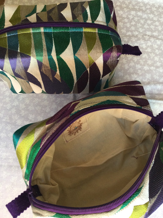 Nest all of your precious essentials together with elegance. This is a stunning silk in all the rich royal colors, royal purple zipper and felt thumb handles make use a breeze.&nbsp; A Silk embracing the rich tones to celebrate each day.&nbsp; &nbsp;Each Nesting Essentials is fully lined and padded with unbleached 100% cotton. Hand wash as needed. Make caring for your personal self a glamorous affair.&nbsp;