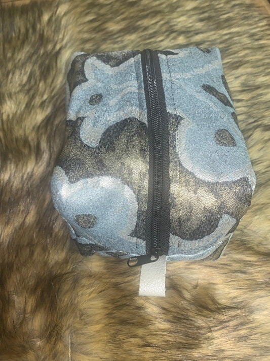 Nest all of your precious essentials together with elegance. This fabric is charcoal and silver with a roman Corinthian pattern in soft blue, as unique as each day. Each Nesting Essentials is fully lined and padded with unbleached 100% cotton. Hand wash as needed. Make caring for your personal self a glamorous affair.